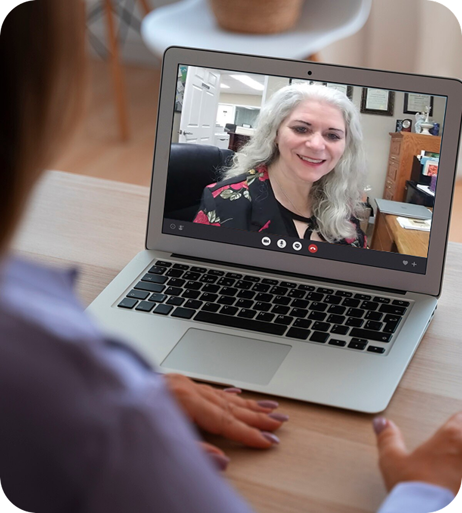 Woman having a video call at home on a laptop device